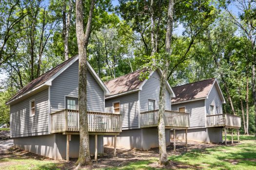 Cabins at Rural Hill Farm nestled in a wooded setting