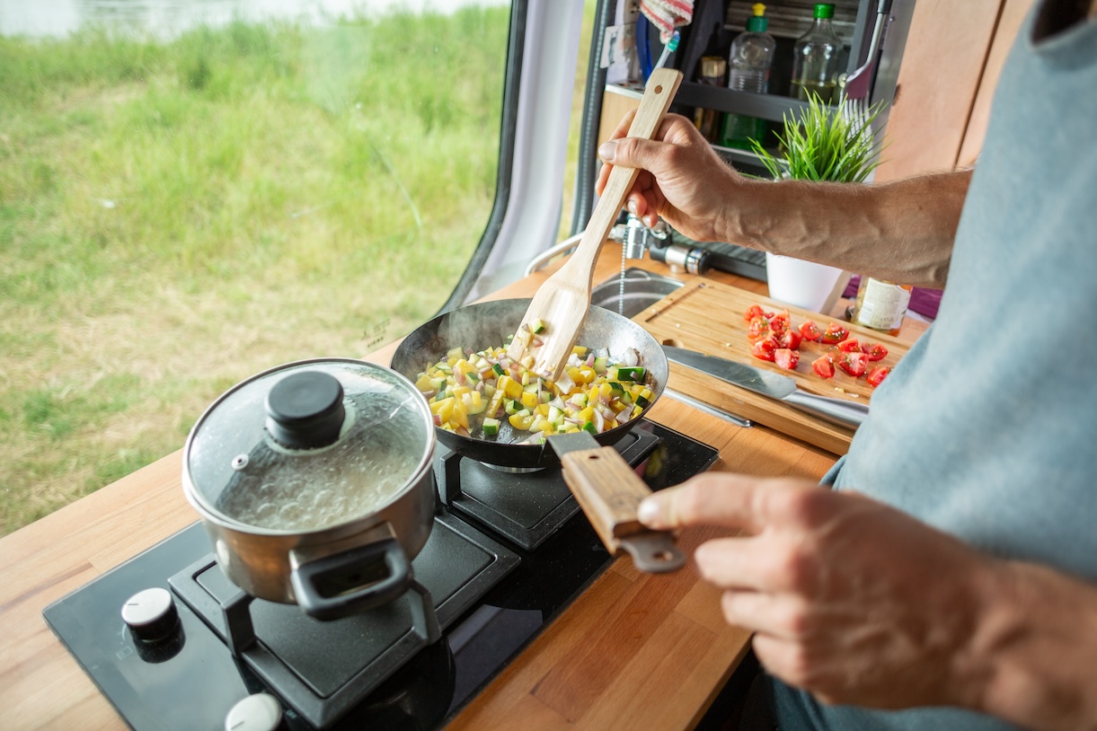 Cooking food on stove in RV.