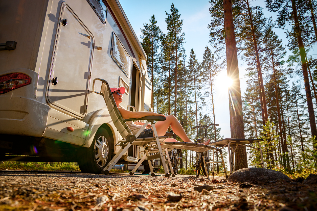 Traveler relaxing outside of RV