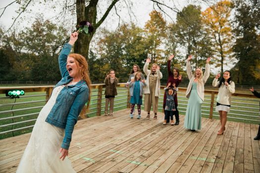Bride enjoying relaxed outdoor wedding celebration with guests at Rural Hill Farm