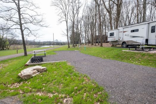 RV site with fire pit and picnic table